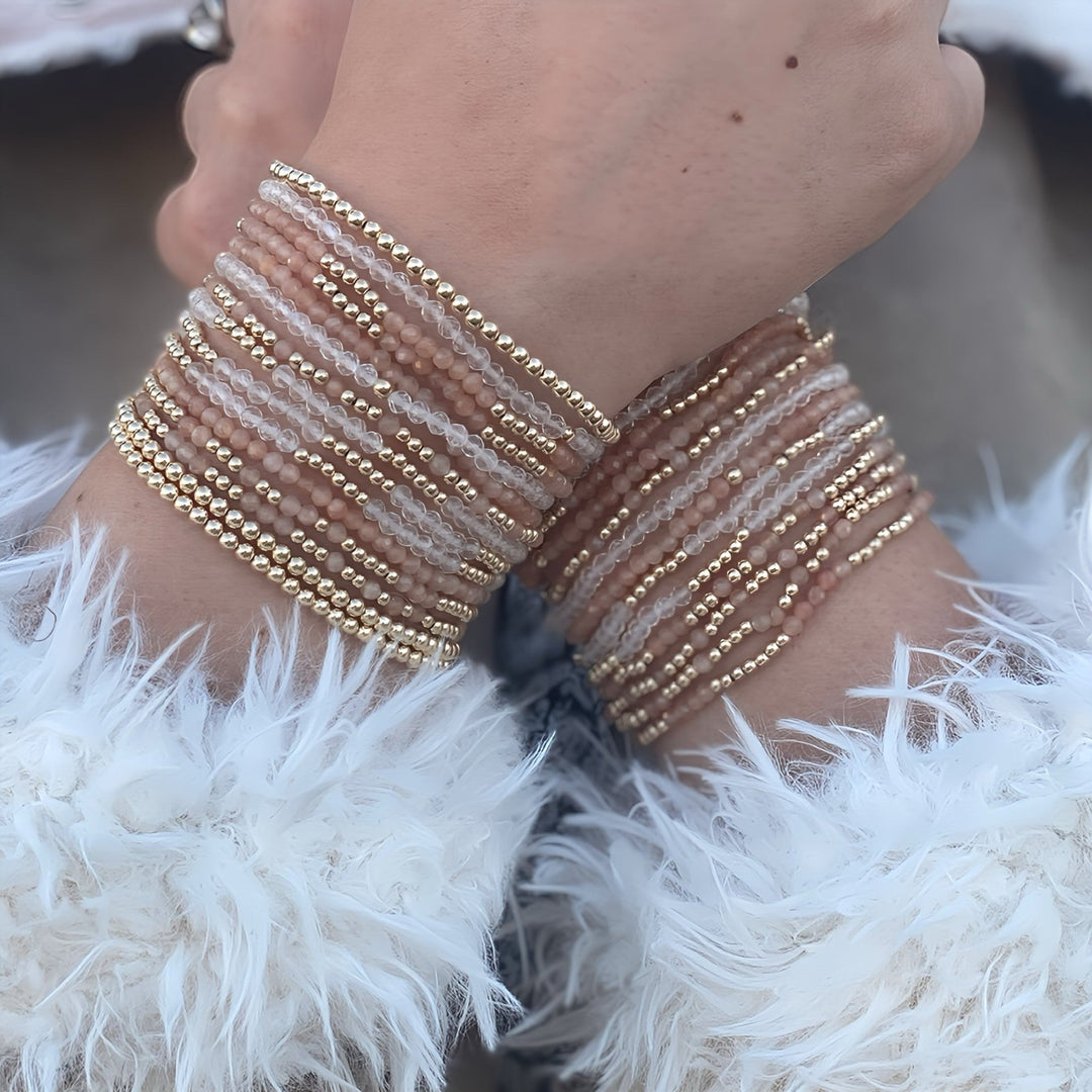 Gold-filled bead bracelet stack on a wrist