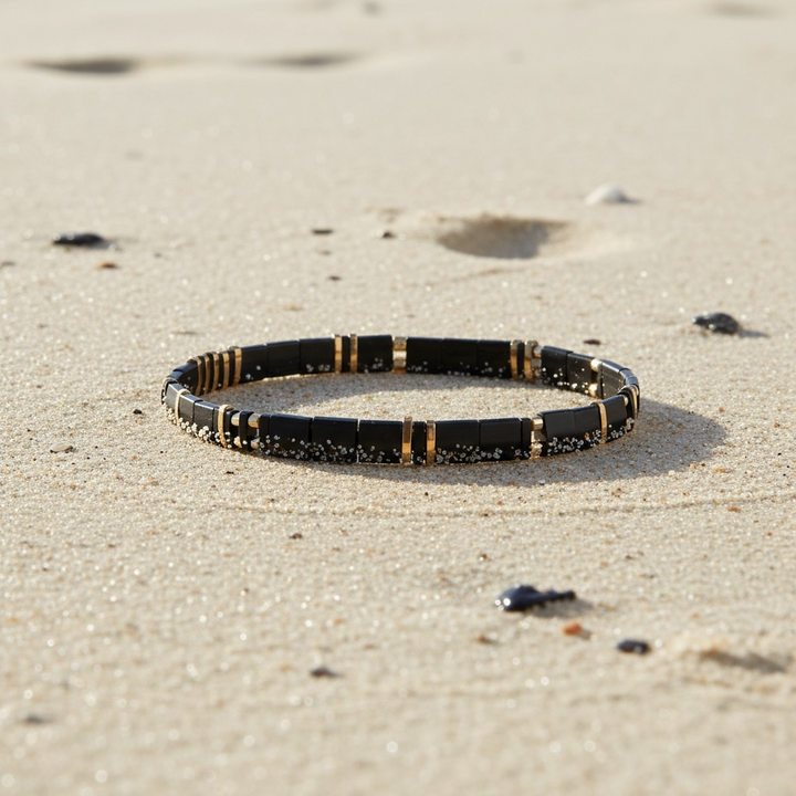 Blackout Tila Bracelet styled on sand – Sugar Bean Jewelry