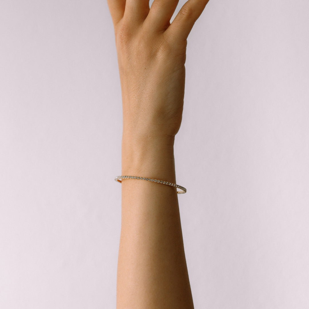 Classic crystal bangle bracelet gold worn on wrist – Sugar Bean Jewelry