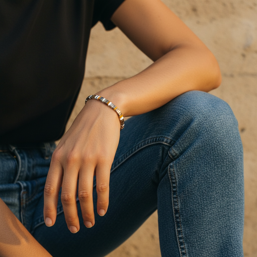 Cognac Tila Bracelet worn on wrist with black tee and denim in golden hour light