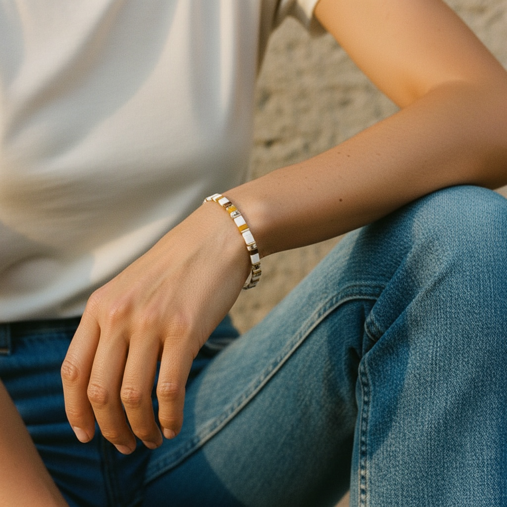Driftwood Tila Bracelet worn on wrist with white top and denim showing beachy neutral tones