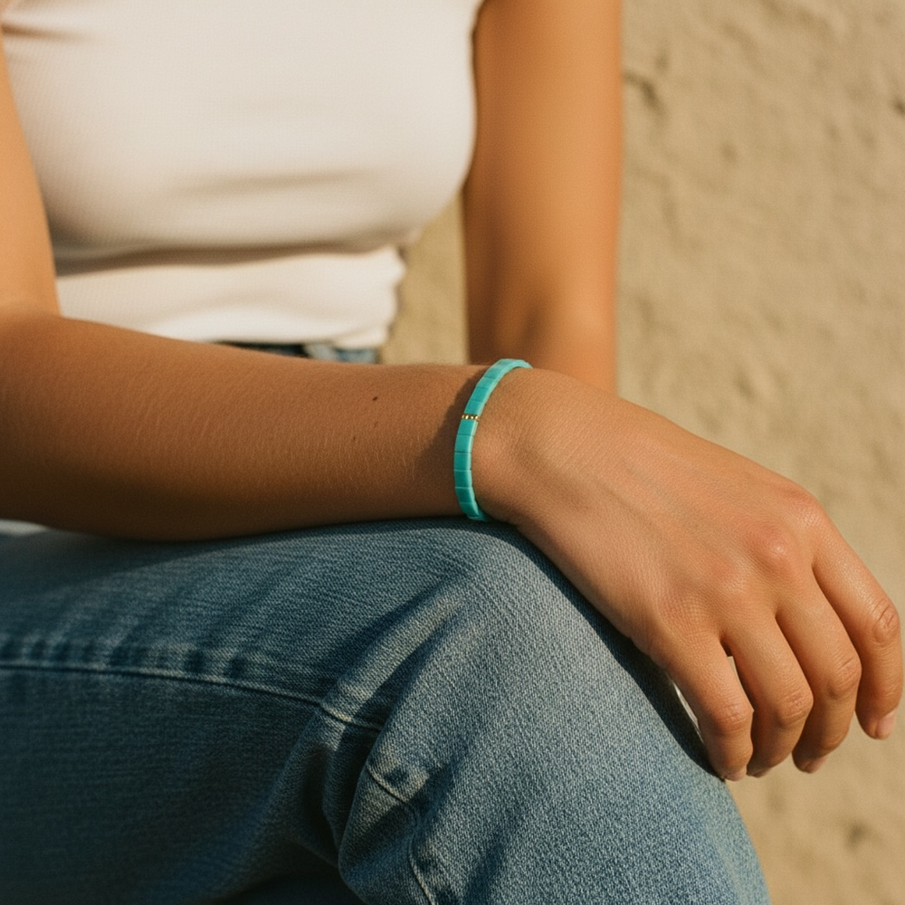 Lagoon Tila Bracelet worn on wrist with white top and denim showing vibrant turquoise color