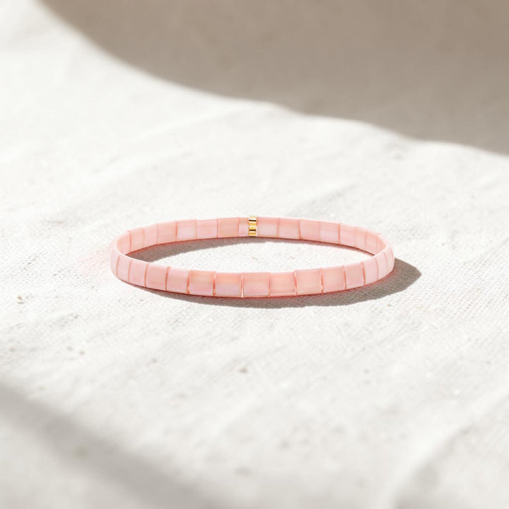 Close-up of peach Miyuki Tila beads interlocked in smooth mosaic pattern – Sugar Bean Jewelry