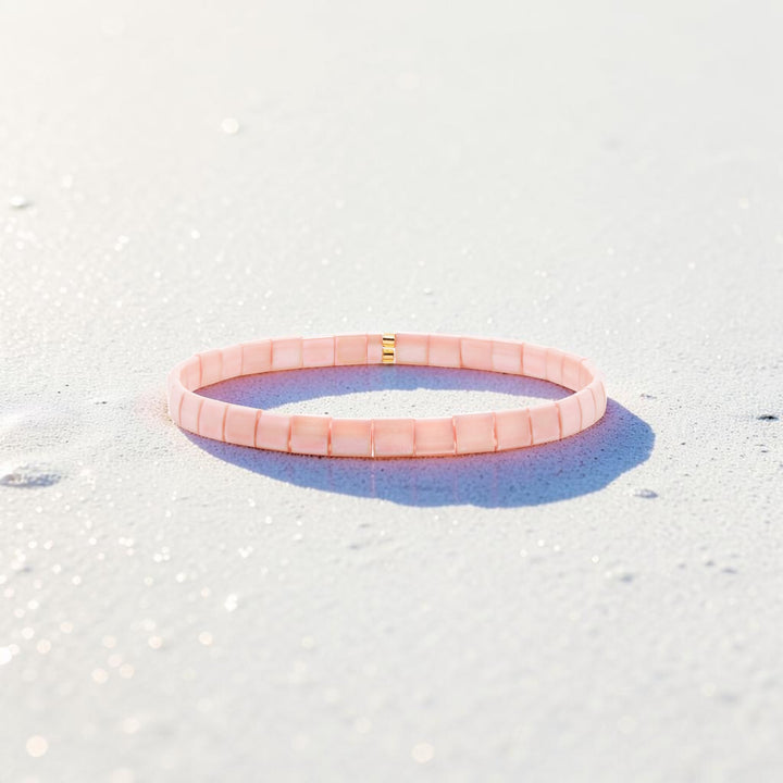 Peach Tila Bracelet worn on wrist – hand-strung stretch bracelet – Sugar Bean Jewelry