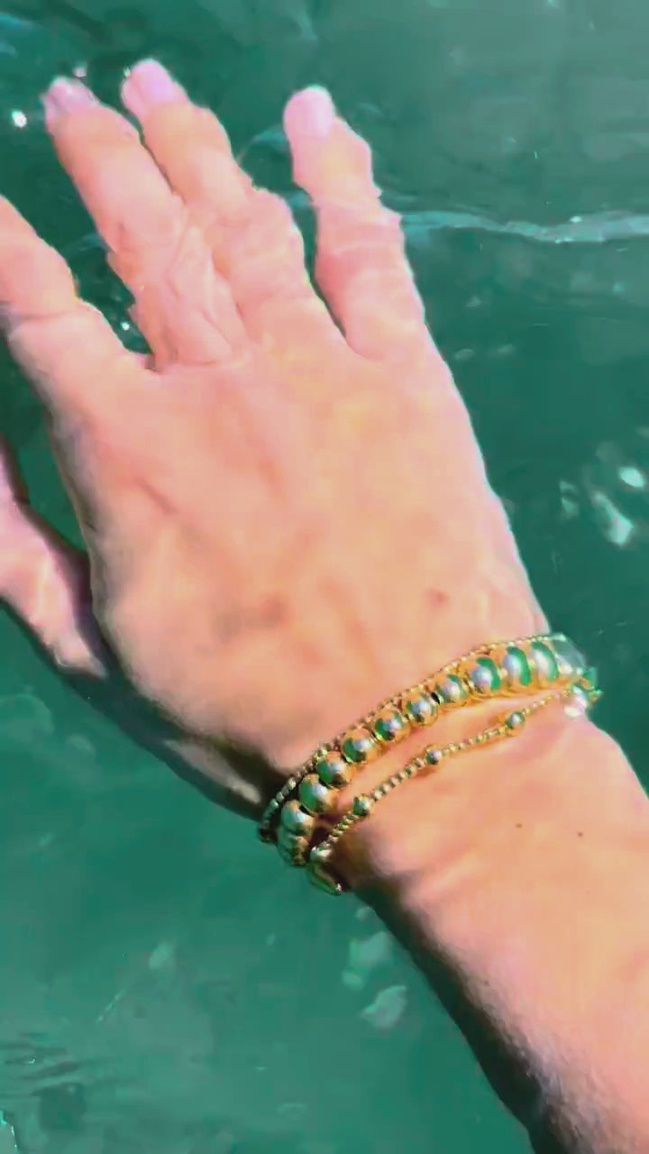 Steadfast 8mm and Pulse gold-filled bracelets underwater