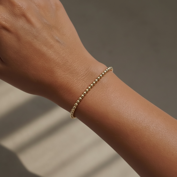Steadfast 3mm gold filled bracelet worn on wrist – Sugar Bean Jewelry