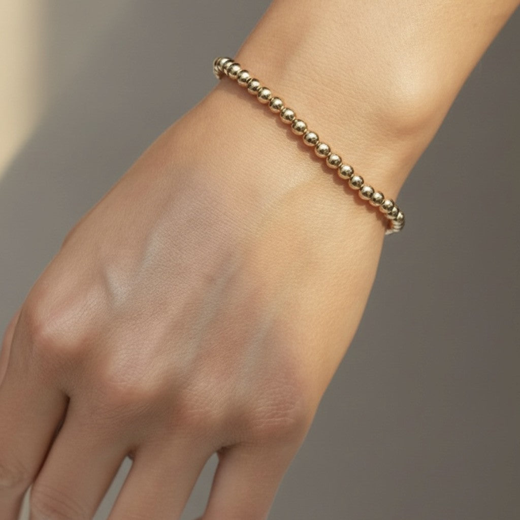 Steadfast 4mm gold filled bracelet worn on wrist – Sugar Bean Jewelry