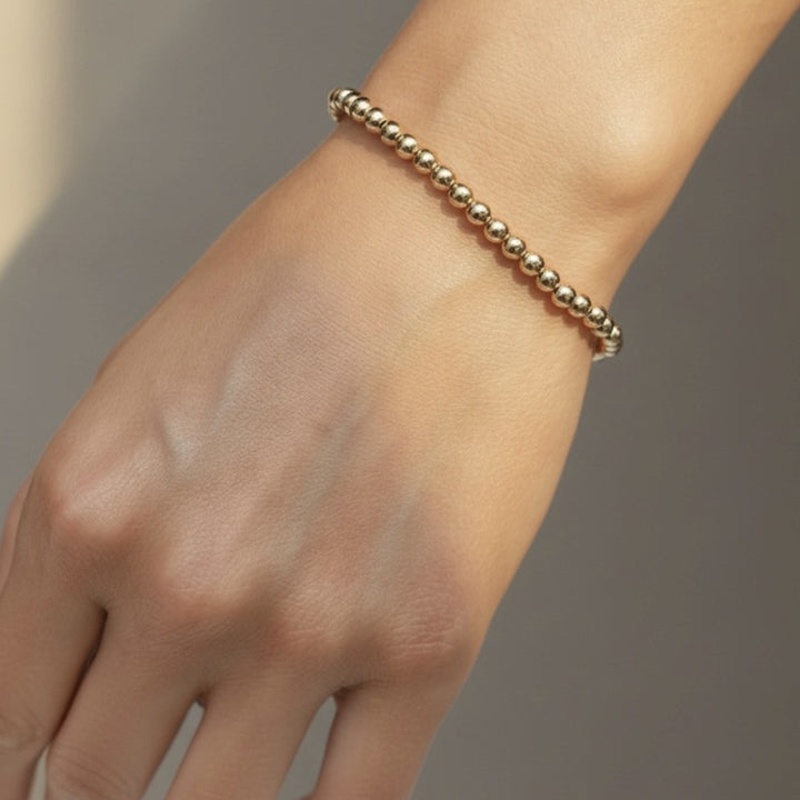 Steadfast 4mm gold filled bracelet worn on wrist – Sugar Bean Jewelry