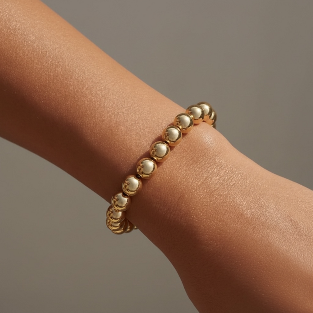 Steadfast 8mm gold filled bracelet worn on wrist – Sugar Bean Jewelry