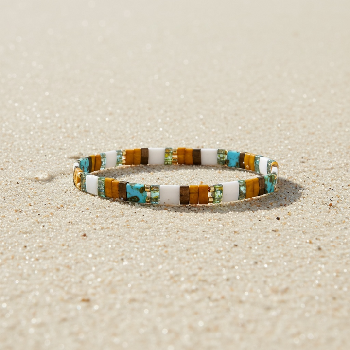 Terrain Tila Bracelet styled on sand – Sugar Bean Jewelry