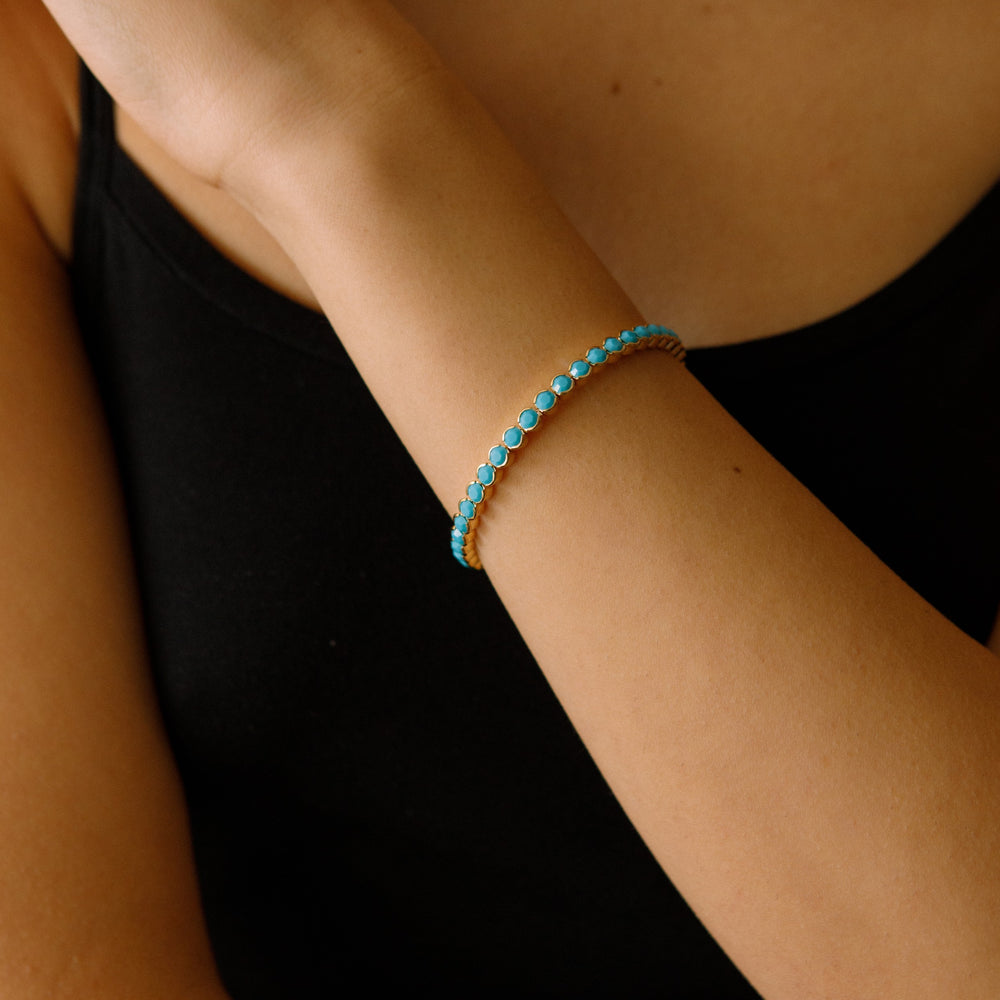 Turquoise gold statement crystal bangle bracelet worn on wrist – Sugar Bean Jewelry