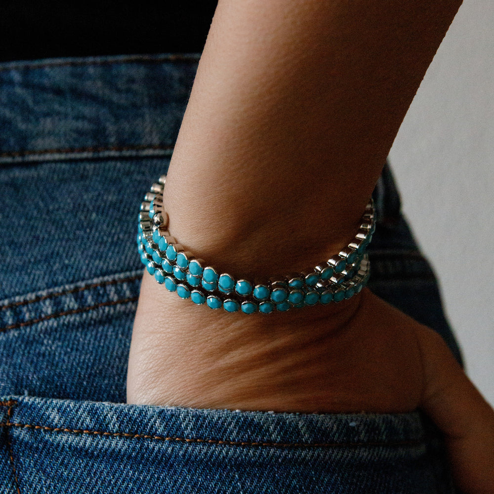 Turquoise silver statement crystal bangle bracelet worn on wrist – Sugar Bean Jewelry