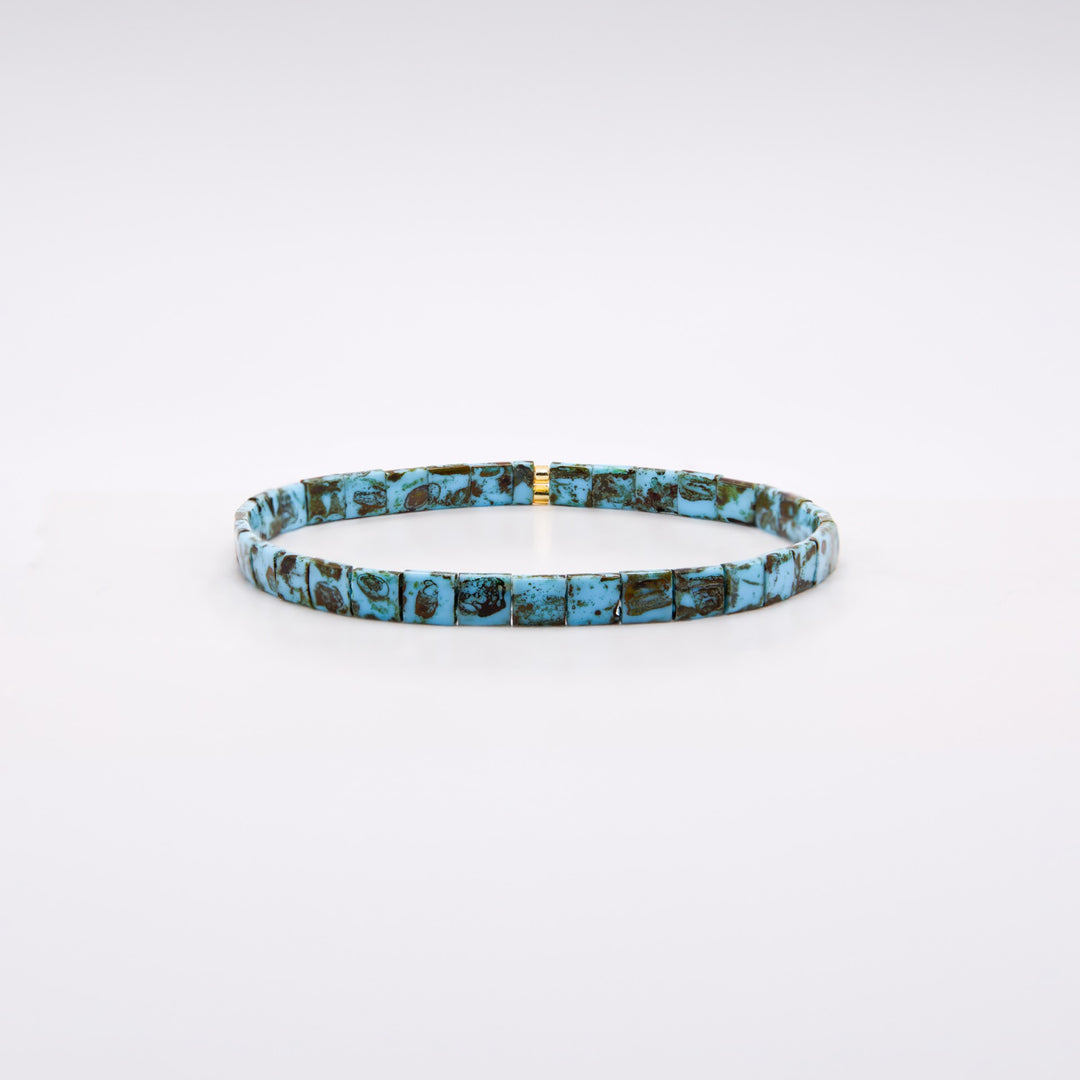 Turquoise and gold Tila bracelet on dark background showing mosaic bead surface – Sugar Bean Jewelry