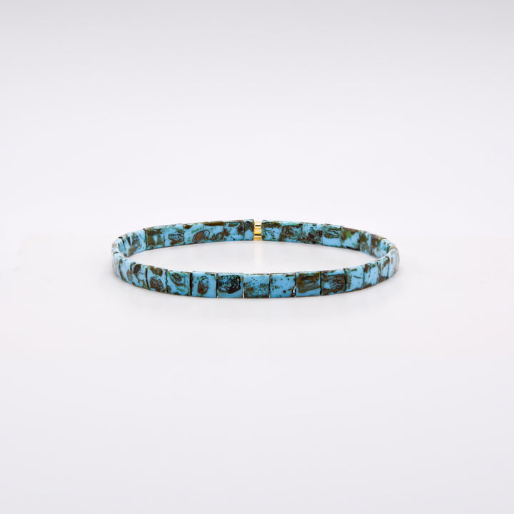 Turquoise and gold Tila bracelet on dark background showing mosaic bead surface – Sugar Bean Jewelry