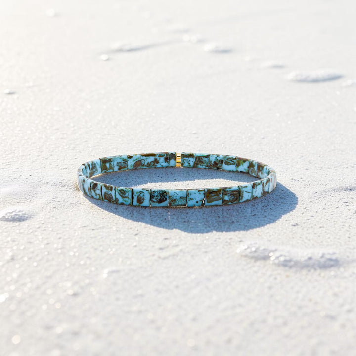 Turquoise and gold Miyuki Tila bead bracelet on white background – Sugar Bean Jewelry