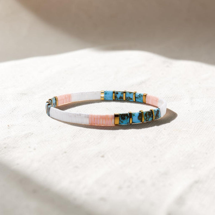 Teal, blush, white, and gold Miyuki Tila bead bracelet on white background – Sugar Bean Jewelry
